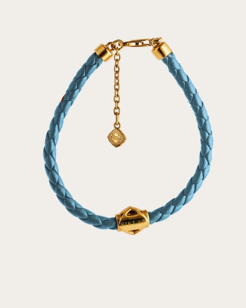 Bracciale Unisex Siklah in cordino colore azzurro con nodi in oro giallo