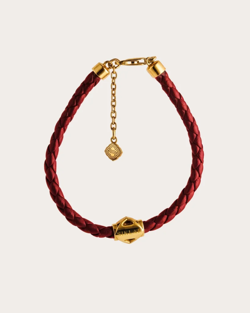 Bracciale Unisex Siklah in cordino colore bordeaux con nodi in oro giallo