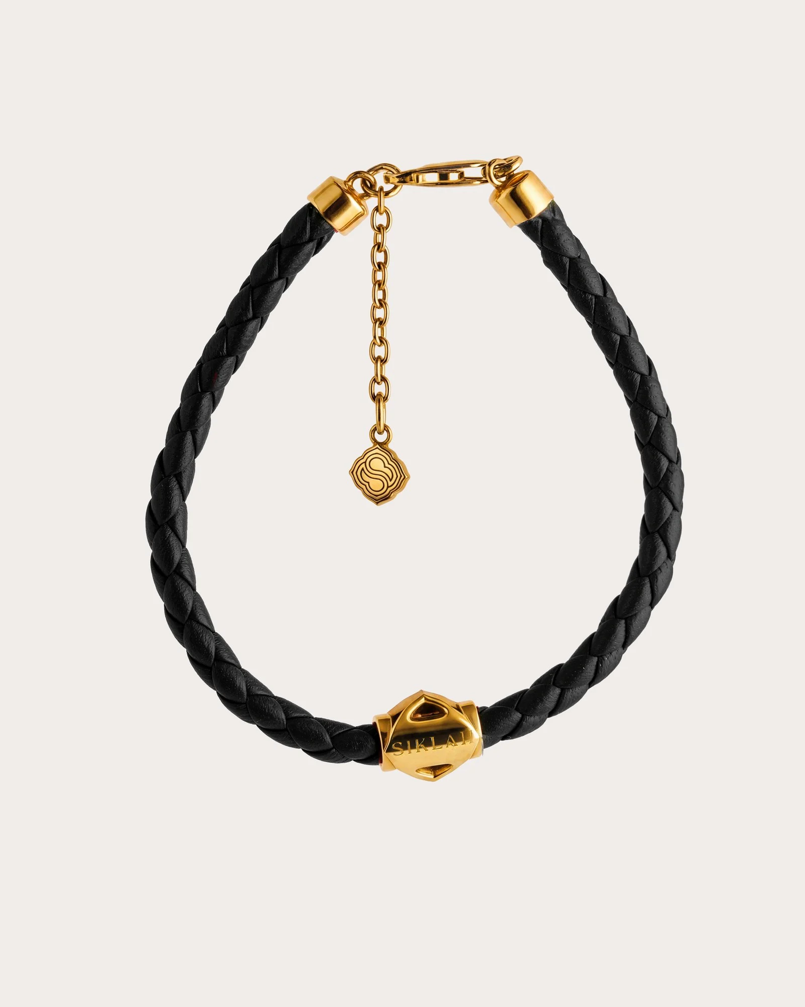 Bracciale Unisex Siklah in cordino colore nero con nodi in oro giallo